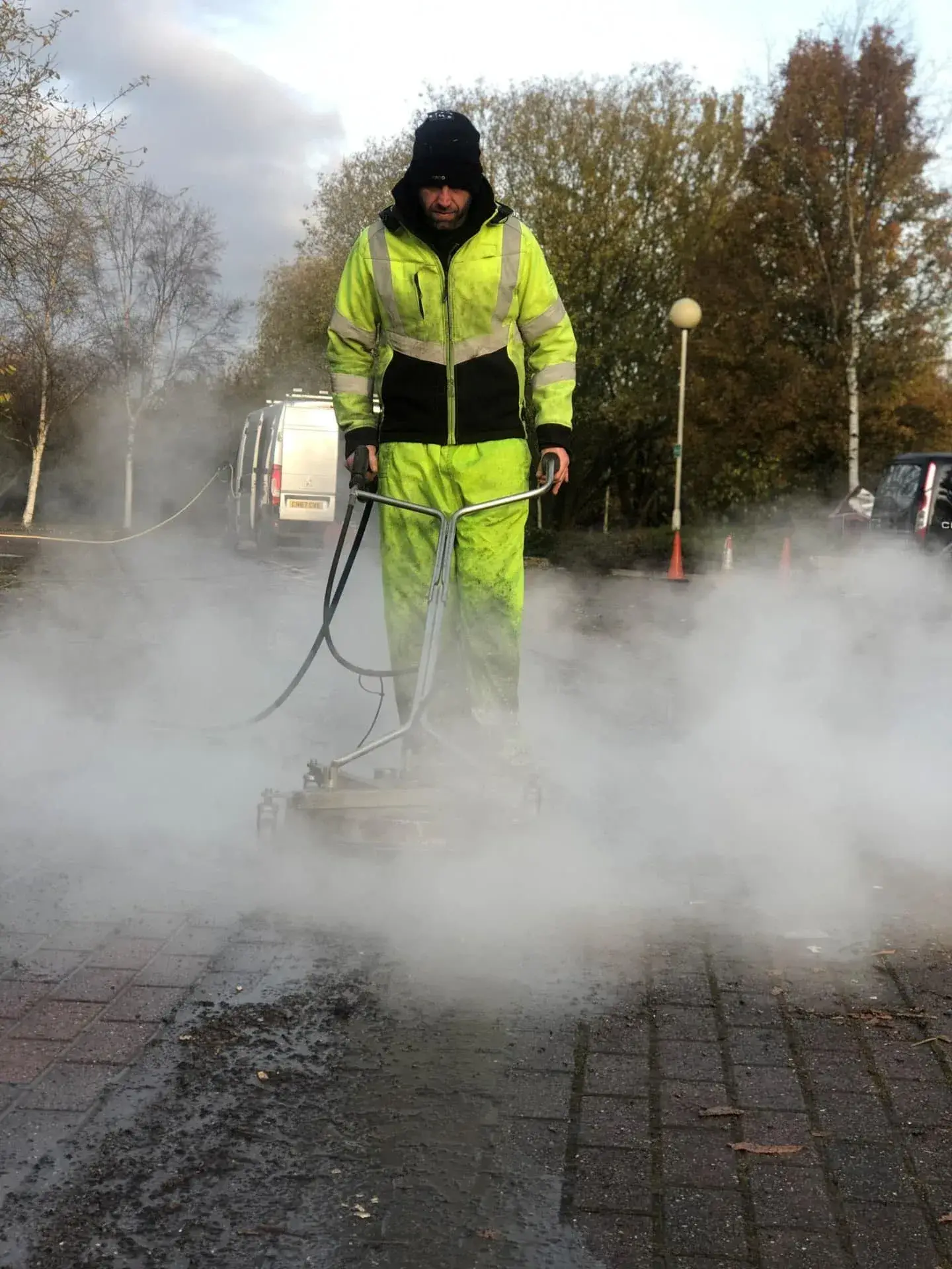 Before and after driveway steam cleaning