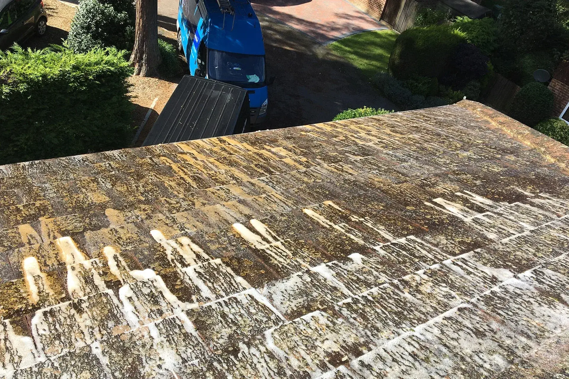 Soft washing a residential surface